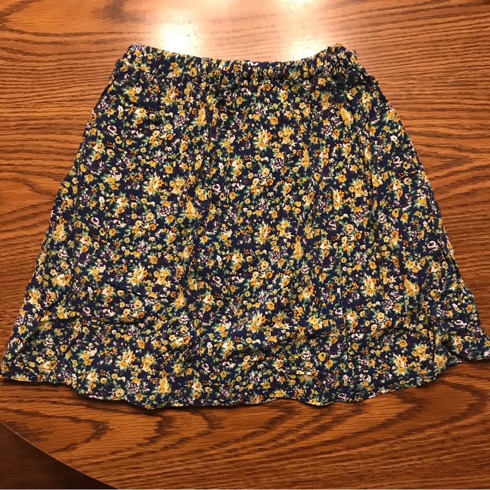 Kirra Skirt, Size XS. Navy with purple, yellow, and white flowers.